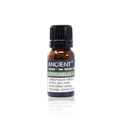A small, 10ml amber glass bottle of Ancient Wisdom Organic Citronella essential oil. The bottle has a black cap and a black label with a light green band. The label lists product details including the Latin name, origin, and distillation process. The bottle is photographed against a clean white background.