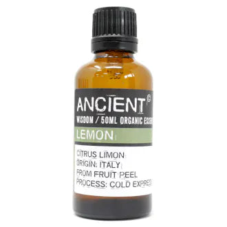 Amber glass bottle labeled 'Ancient Wisdom Organic Essential Oil Lemon 50ml,' origin Italy, made from fruit peel, cold expressed.