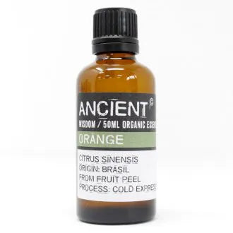 Amber glass bottle labeled 'Ancient Wisdom Organic Essential Oil Orange 50ml,' origin Brazil, made from fruit peel, cold expressed.