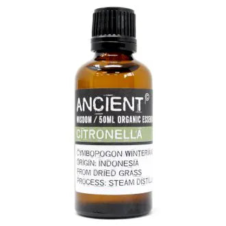 Amber glass bottle labeled 'Ancient Wisdom Organic Essential Oil Citronella 50ml,' origin Indonesia, made from dried grass, steam distilled.