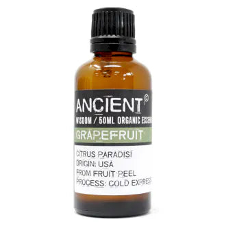 Amber glass bottle labeled 'Ancient Wisdom Organic Essential Oil Grapefruit 50ml,' origin USA, made from fruit peel, cold expressed.