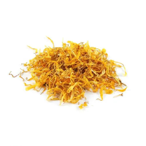 A pile of dried, yellow marigold petals displayed on a pure white background. The image is a top-down view highlighting the fine, stringy texture and vibrant, bright yellow-orange color of the petals.
