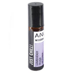 Amber glass roll-on bottle with a black cap labeled "Just Chill!" by Ancient Wisdom. The purple label highlights lavender, rose, and vetiver essential oils. The cap is securely closed.